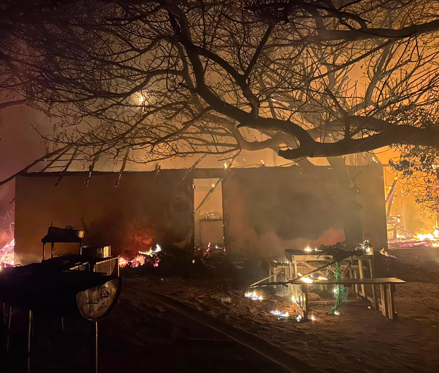 The fire taking hold at Bemugi's Place during the early hours of 6 August 2026