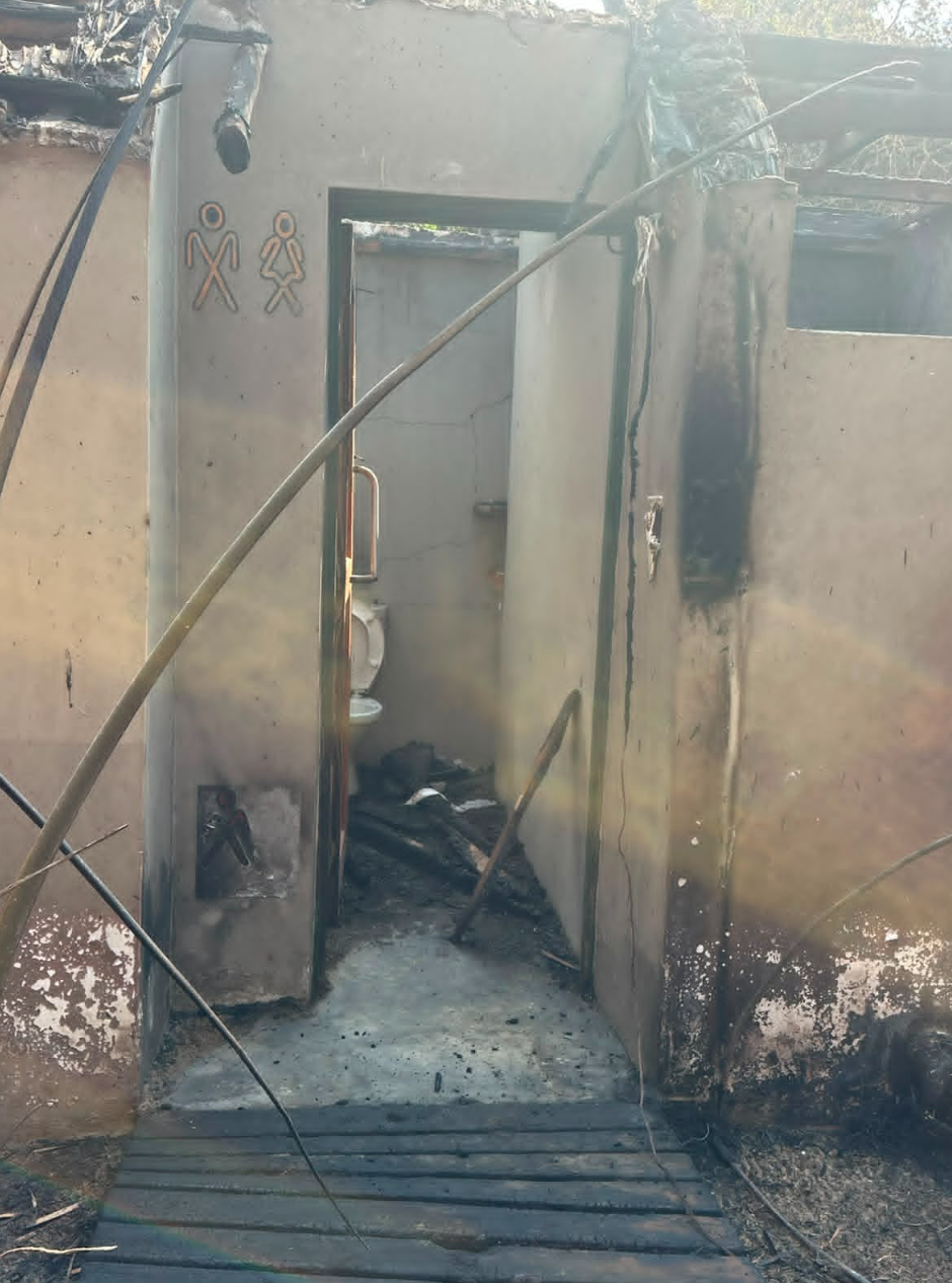 Burnt bathroom and toilet area after the fire