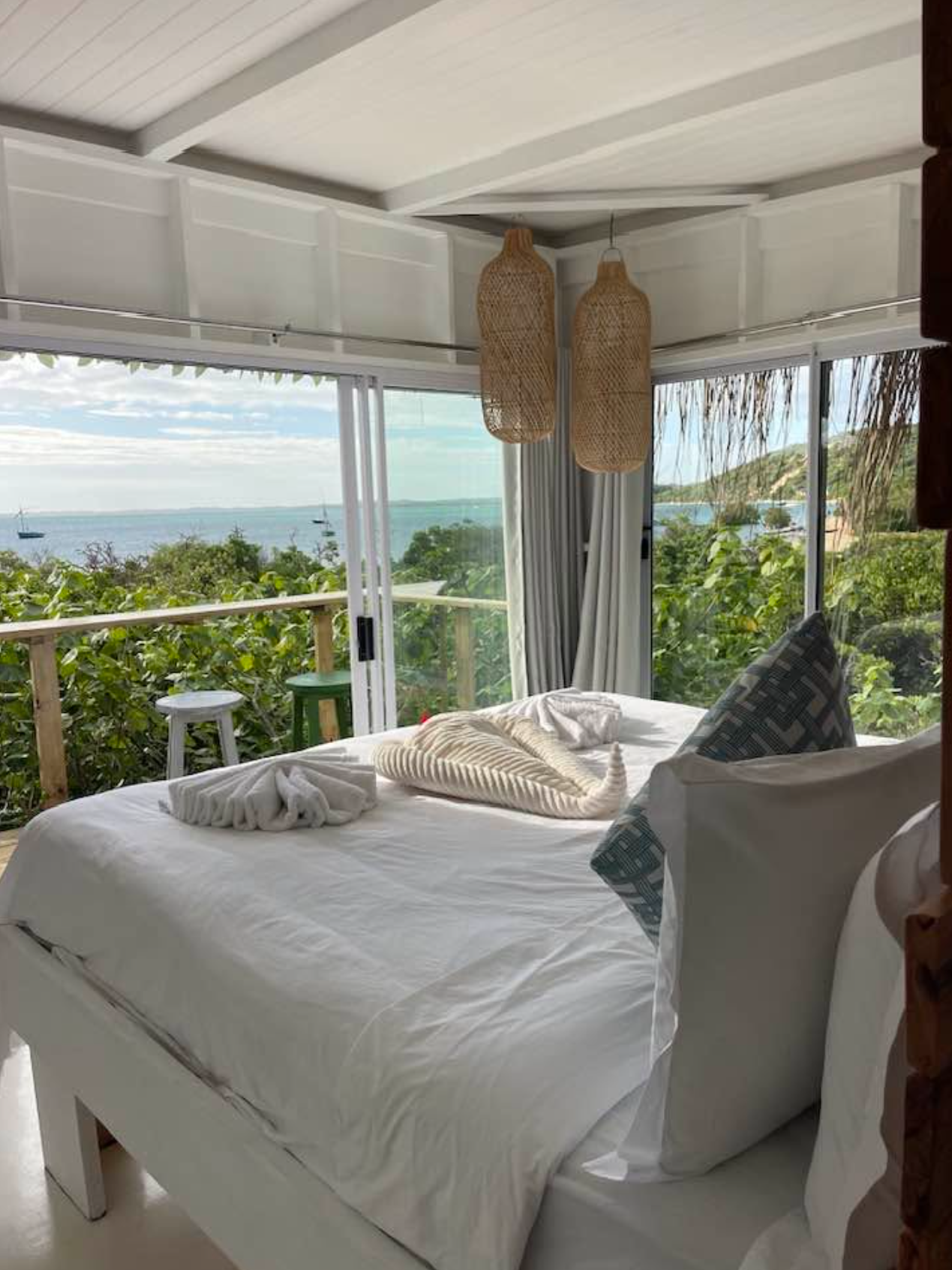Upper bedroom with private balcony overlooking the bay