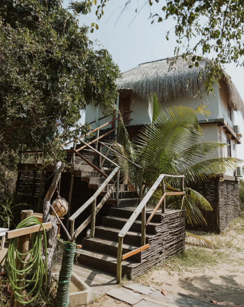 Wooden staircase leading to the entrance of the house