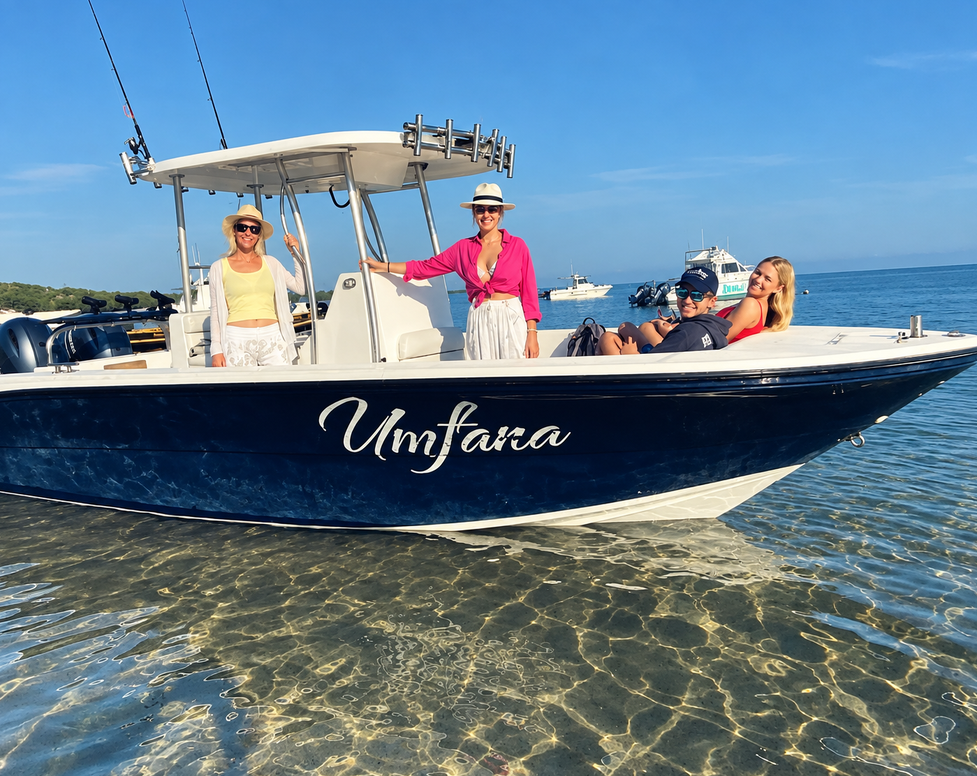 Guests aboard the Umfara boat in clear Santa Maria waters
