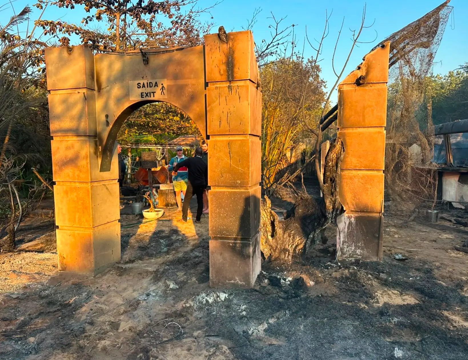 The burnt archway and entrance after the fire