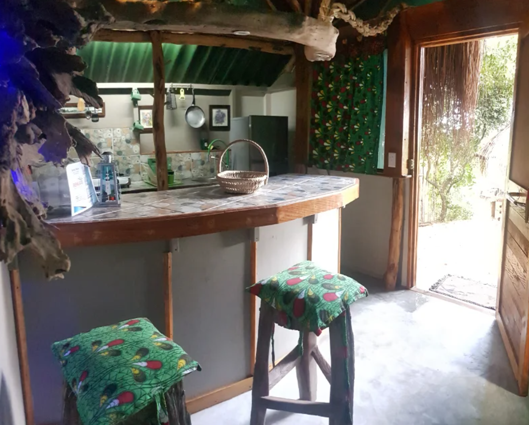 Kitchen with patterned stools and garden doorway