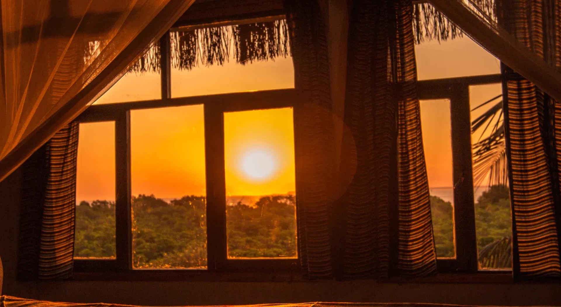 Sunset view across Maputo Bay through the upstairs windows