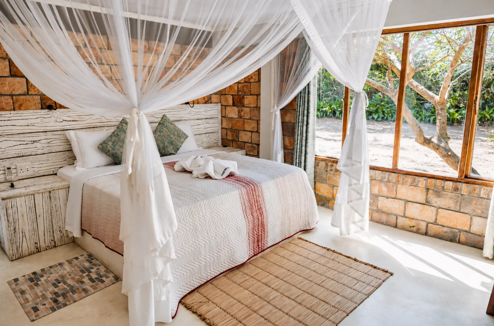 Two Bedroom House bedroom with a mosquito-net canopy and garden view