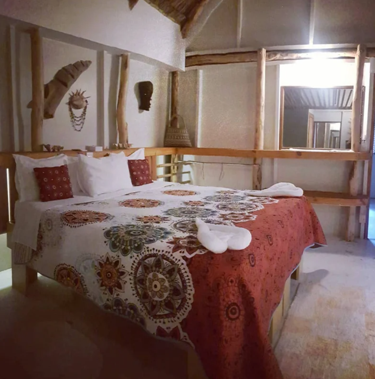 Second bedroom view with patterned linens